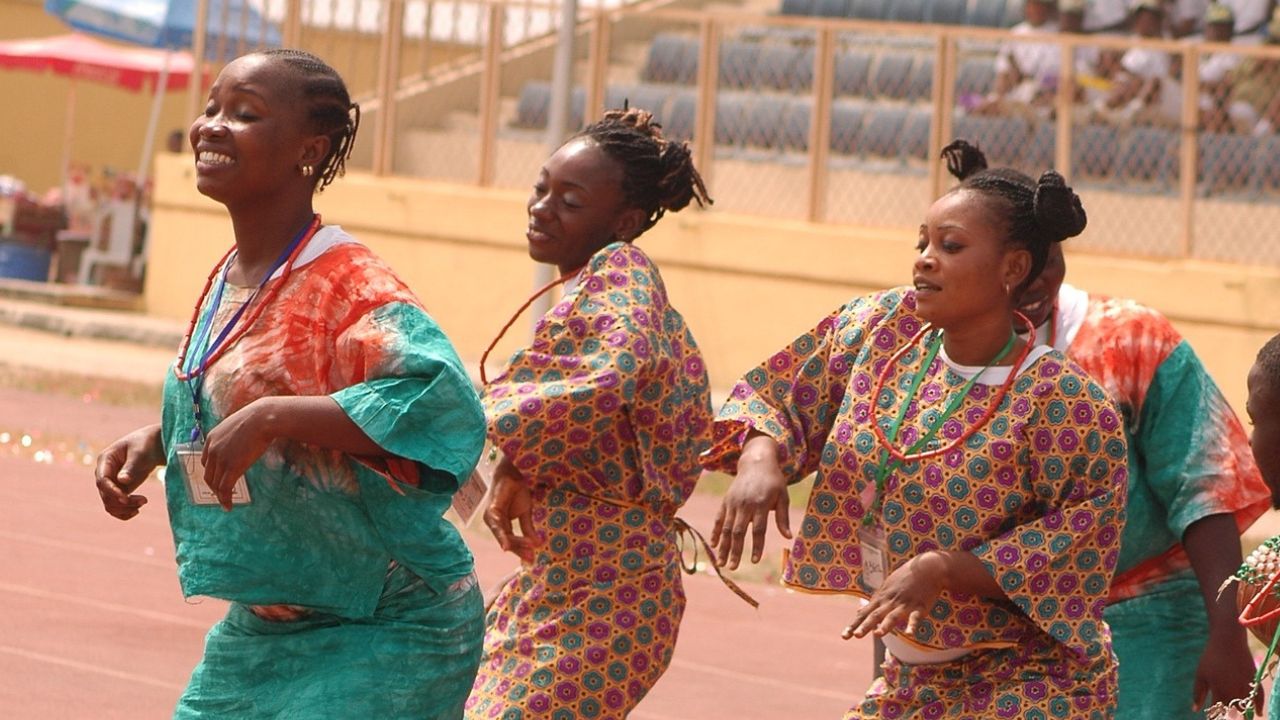 NYSC members collaborating on a community development project through cultural showcase