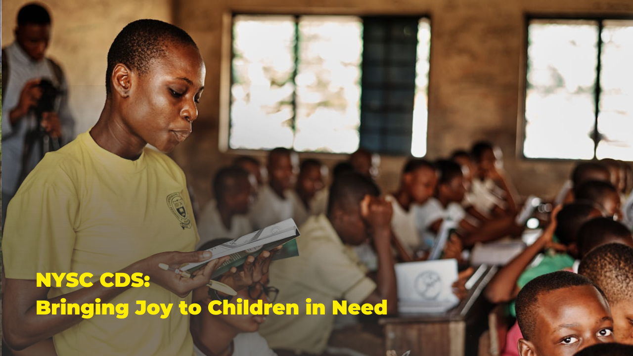 NYSC members reading to children at an orphanage